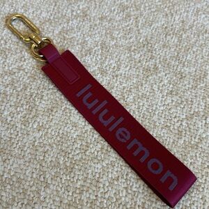 Lululemon Never Lost Keychain Key Holder in Pomegranate/Oceanic Gold Hardware